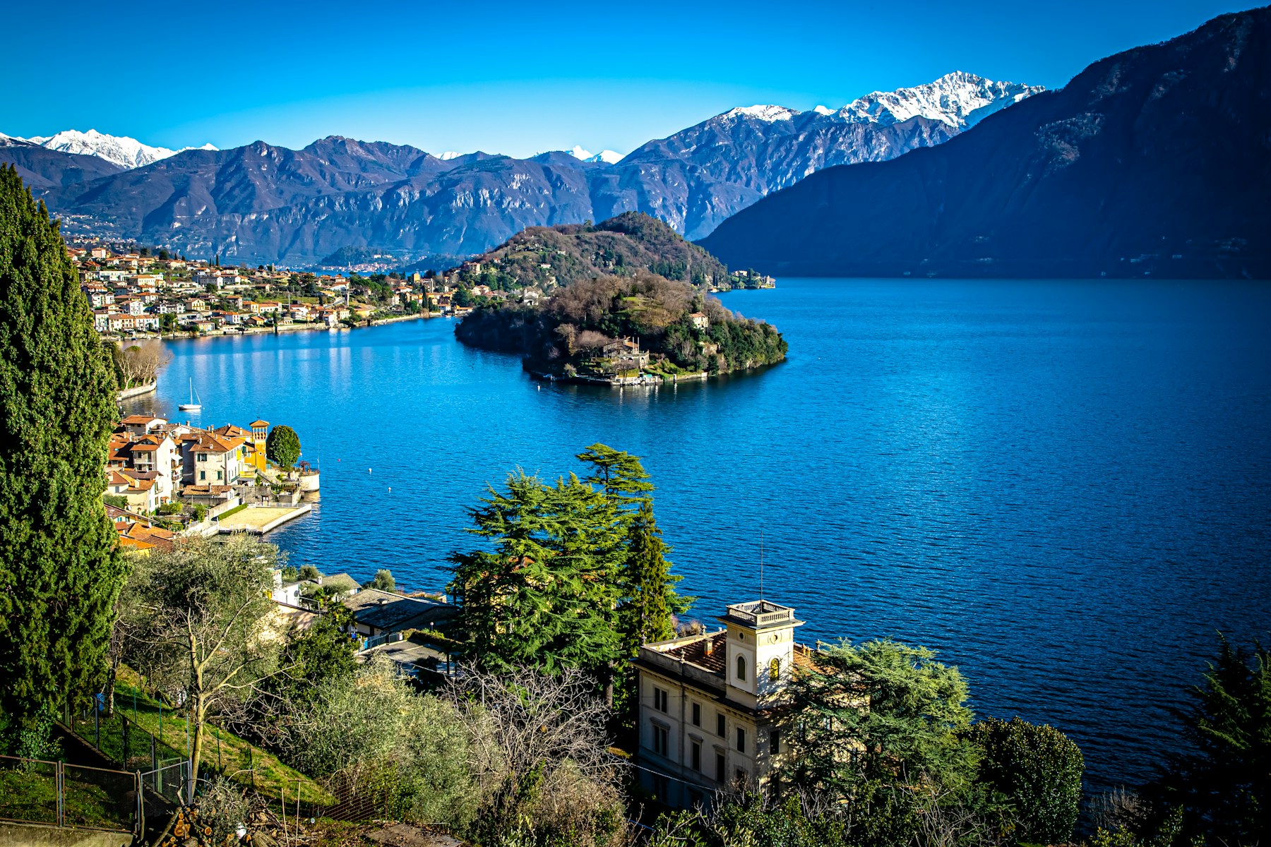 Mountain reflections on Lake Como and the elegant lakeside villas of northern Italy